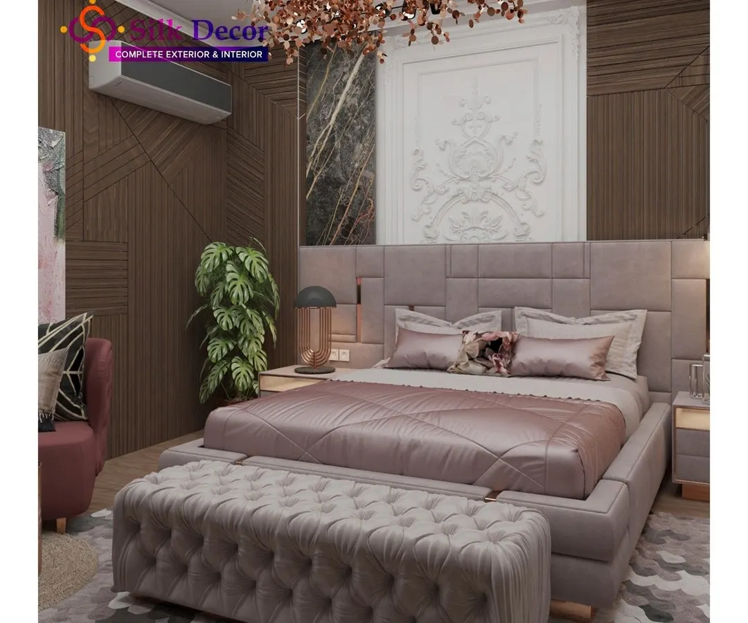 We designed this bedroom to be a true sanctuary. The centerpiece is a large, custom-upholstered bed in a sophisticated grey fabric, paired with a matching deep-tufted bench at its foot. This project highlights our ability to create coordinated bedroom sets that balance modern design with plush comfort.