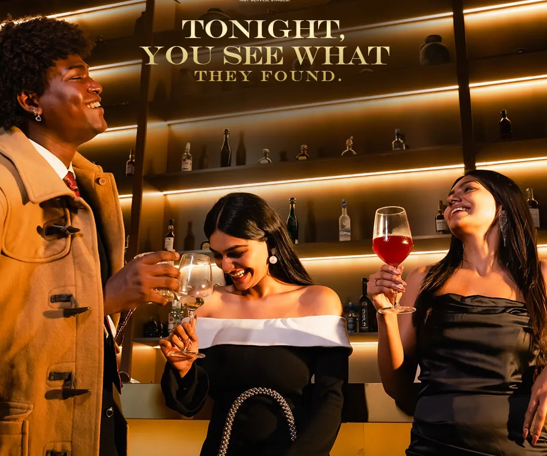 Here, conversations flow as smoothly as the wine. This moment captures the essence of our social scene: sophisticated, effortless, and alive with connection against the warm glow of our backlit bar.
