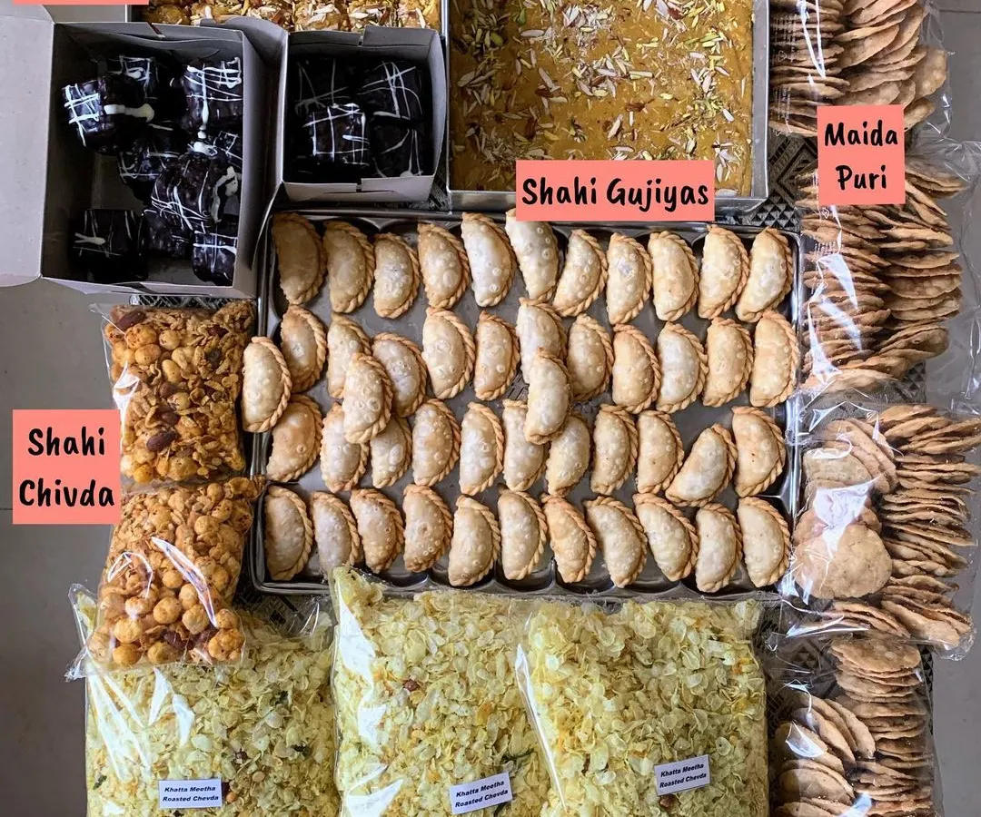 A beautiful festive spread for Raksha Bandhan, featuring a mix of my traditional sweets and modern baked goods. This shows the variety I offer, including Shahi Gujiyas, Mohanthal, Double Chocolate Brownies, and savory chivda.