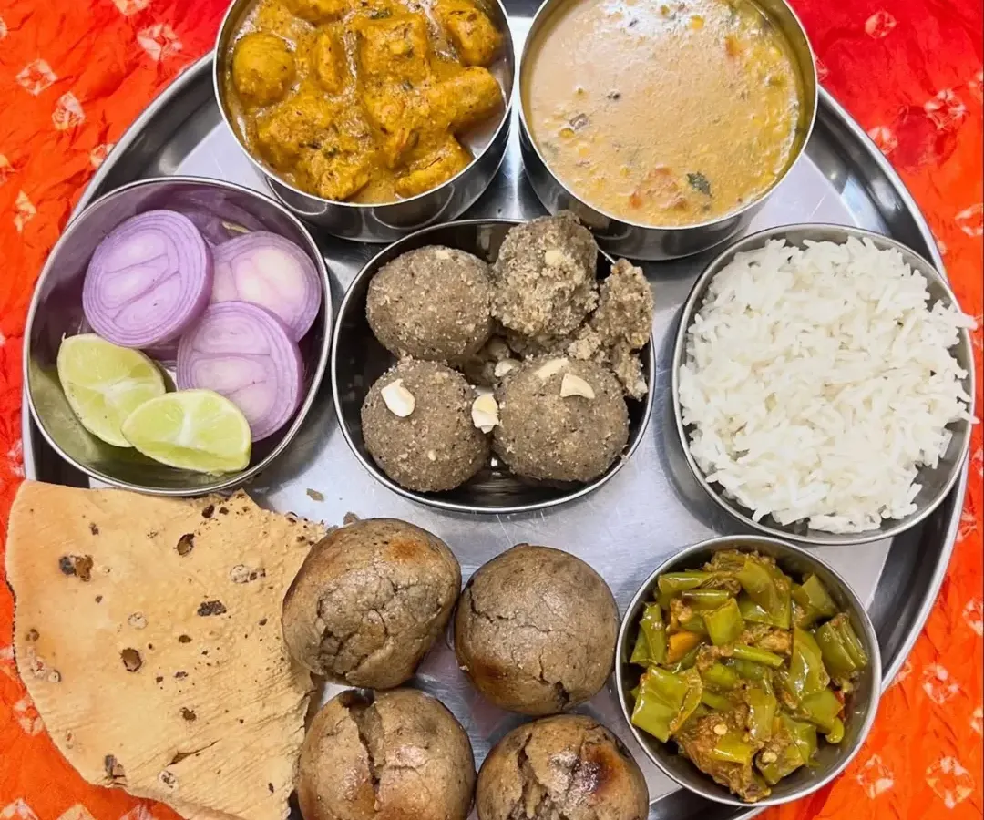 The heart of our service is the authentic Rajasthani Thali. This plate features our signature Dal, Bati, and Churma, made with traditional recipes and pure ingredients for a taste of true Rajasthani heritage.