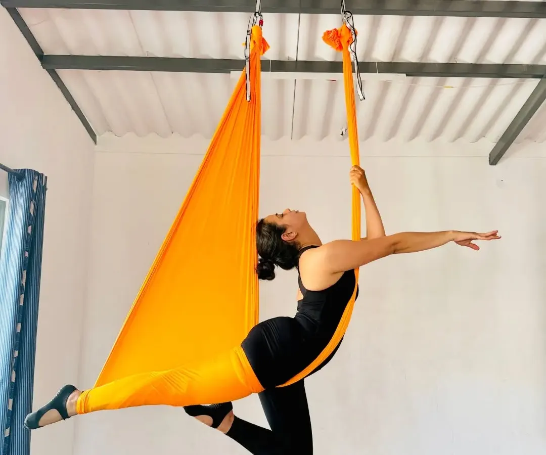 Aerial yoga is where strength meets grace in the air. This beautiful pose showcases the freedom and elegance you can discover in our specialized Aerial Yoga Teacher Training Course, learning to fly with confidence in our Mysore studio.