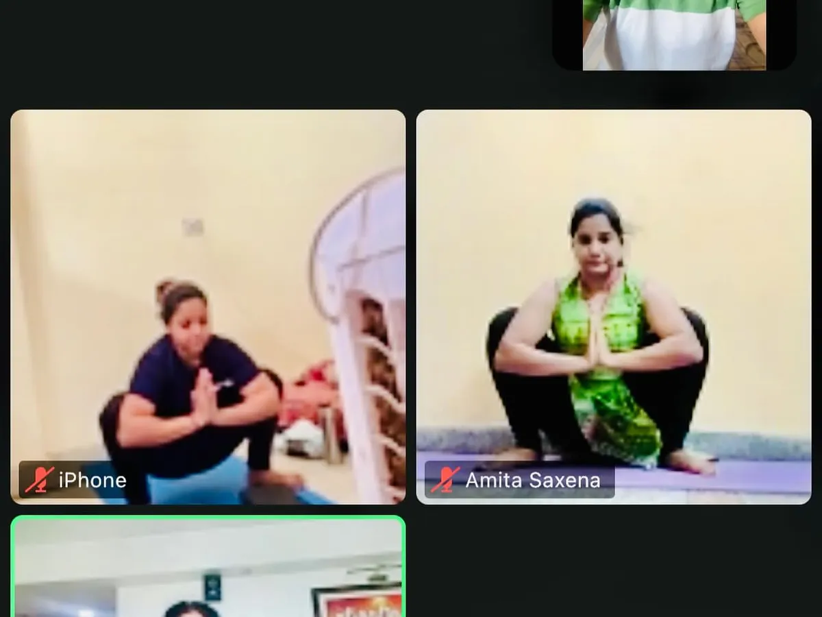 A snapshot from one of our live online group yoga classes. Even through a screen, I make sure to observe everyone's posture, like in this Malasana (Garland Pose), to provide personal corrections and build a strong virtual community.