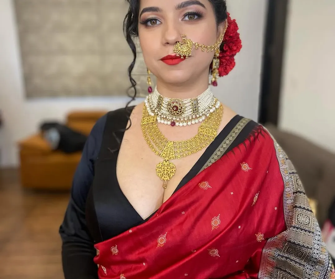 A classic reception look featuring a timeless red lip and defined eyes. I focused on creating a flawless base that lasts through the night while still looking like real skin, complemented by a traditional red rose bun.