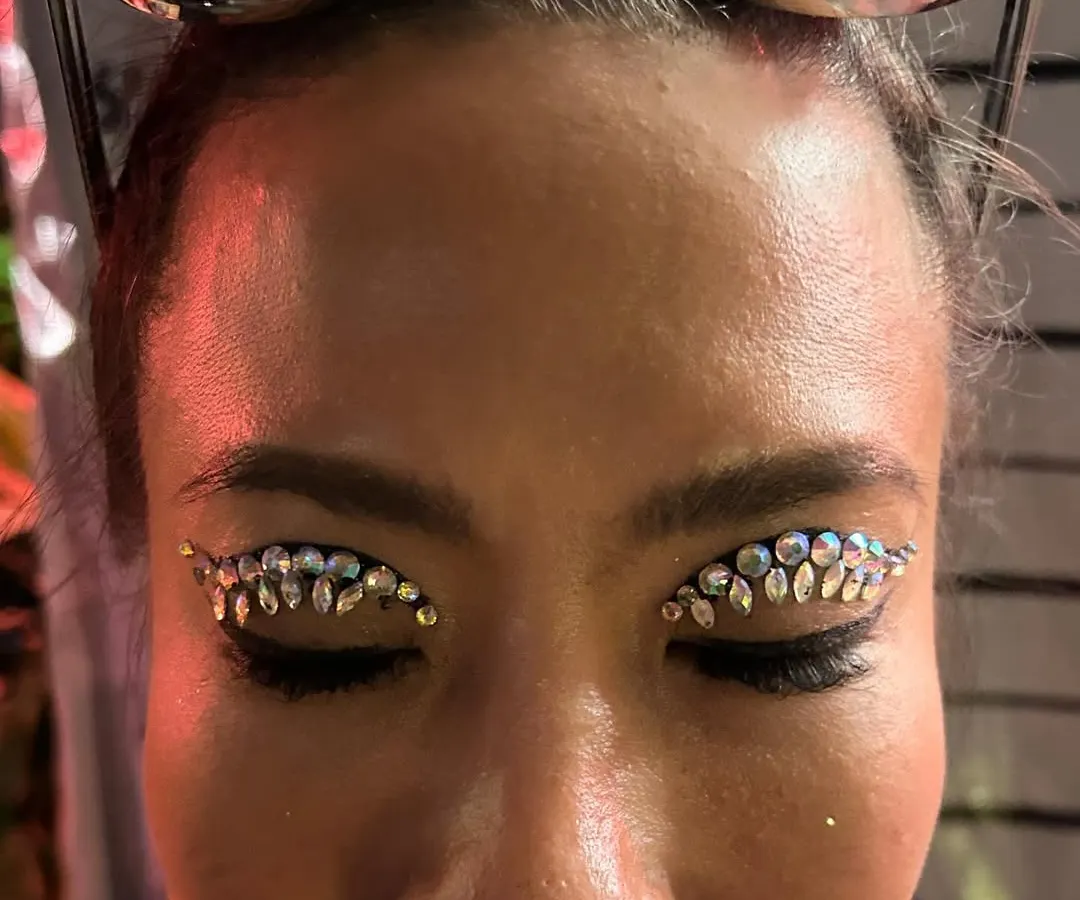 We love to bedazzle! This custom rhinestone eye makeup is perfect for music festivals, sangeet nights, or any event where you want to shine. All our face jewels are skin-safe and applied to last through the night.