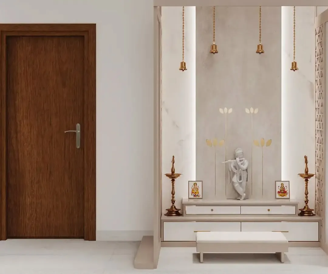 Your pooja space should be a sanctuary of peace. Here, I've created a modern prayer nook using a palette of serene whites and warm neutrals, accented by soft backlighting and traditional brass bells. This Vastu-aligned design provides a calm, divine corner that feels both sacred and sophisticated.