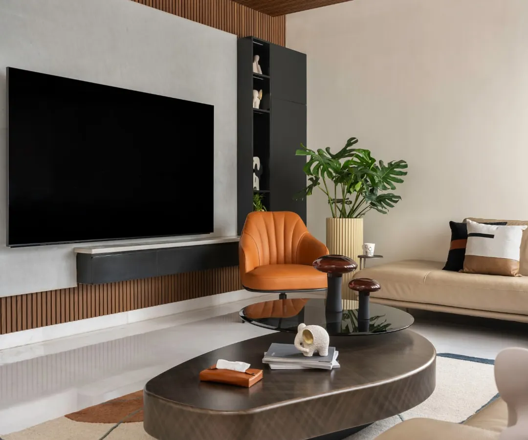 I believe a living room should be a seamless blend of style and comfort. This space features a modern media wall with integrated storage, a comfortable sectional sofa, and a mix of textures that create a warm, inviting atmosphere for relaxation and entertainment.