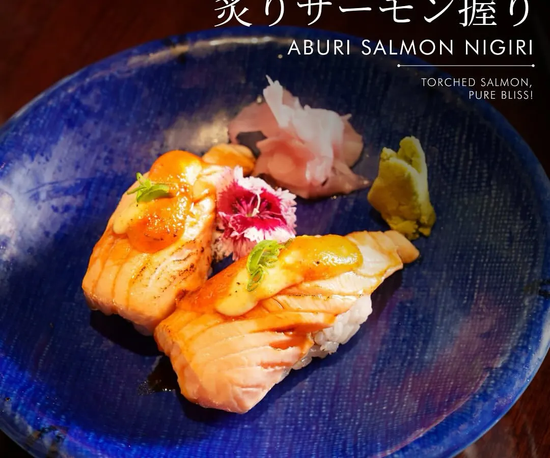 Experience the sublime flavor of our Aburi Salmon Nigiri. We lightly torch premium salmon to unlock a smoky aroma and a melt-in-your-mouth texture that is pure bliss. Served on a bed of perfectly seasoned rice, this is a modern take on a classic that has become a favorite among our guests.
