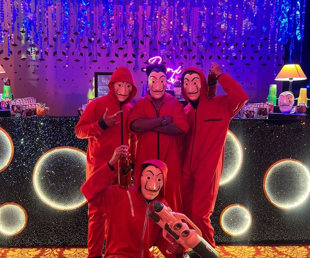 We go all-in on themes. Here's our team ready for a Money Heist themed sangeet, complete with red jumpsuits and masks, proving we're not just bartenders, we're part of the entertainment.