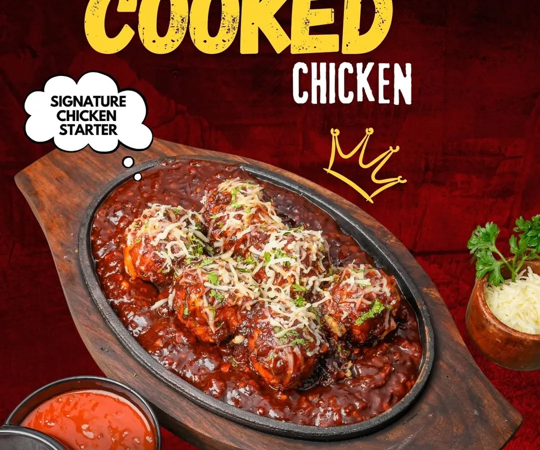 This is our signature Double Cooked Chicken, a starter that's crispy on the outside and tender on the inside. It's served sizzling in a rich, tangy sauce and topped with cheese, making it a favourite for many of our guests.