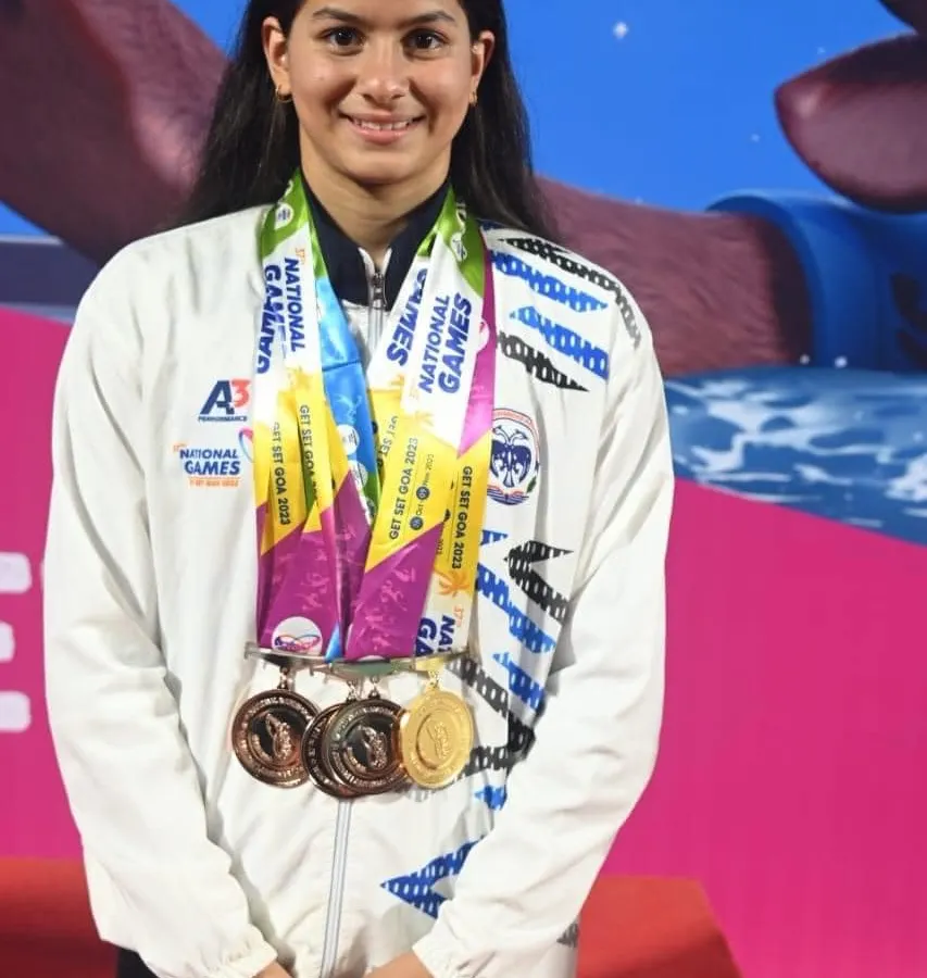We train athletes to win. This is one of our national-level swimmers, showcasing the medals earned through relentless dedication and our expert coaching at the National Games.