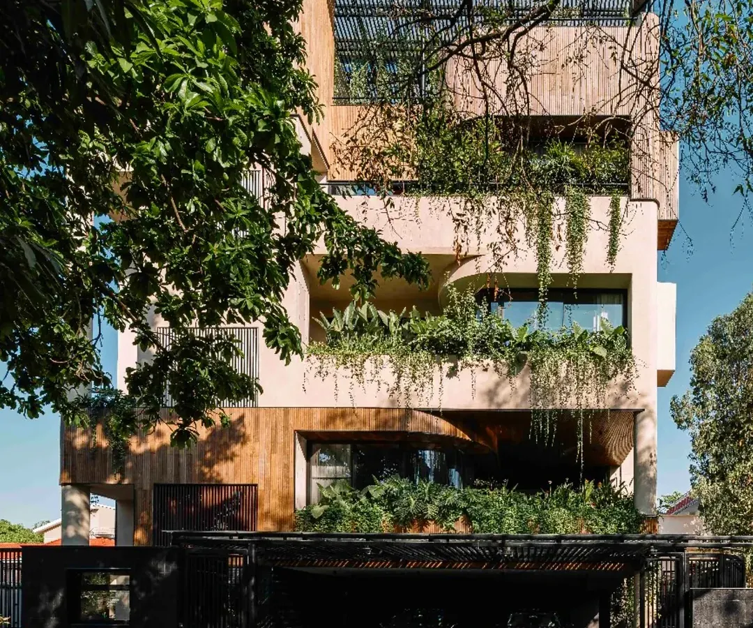 For this Bengaluru home, we challenged the shrinking of green spaces in dense urban areas. The structure unfolds as a series of staggered volumes, with gardens and trees woven into every level, creating a private sanctuary that breathes and extends the city's garden identity.