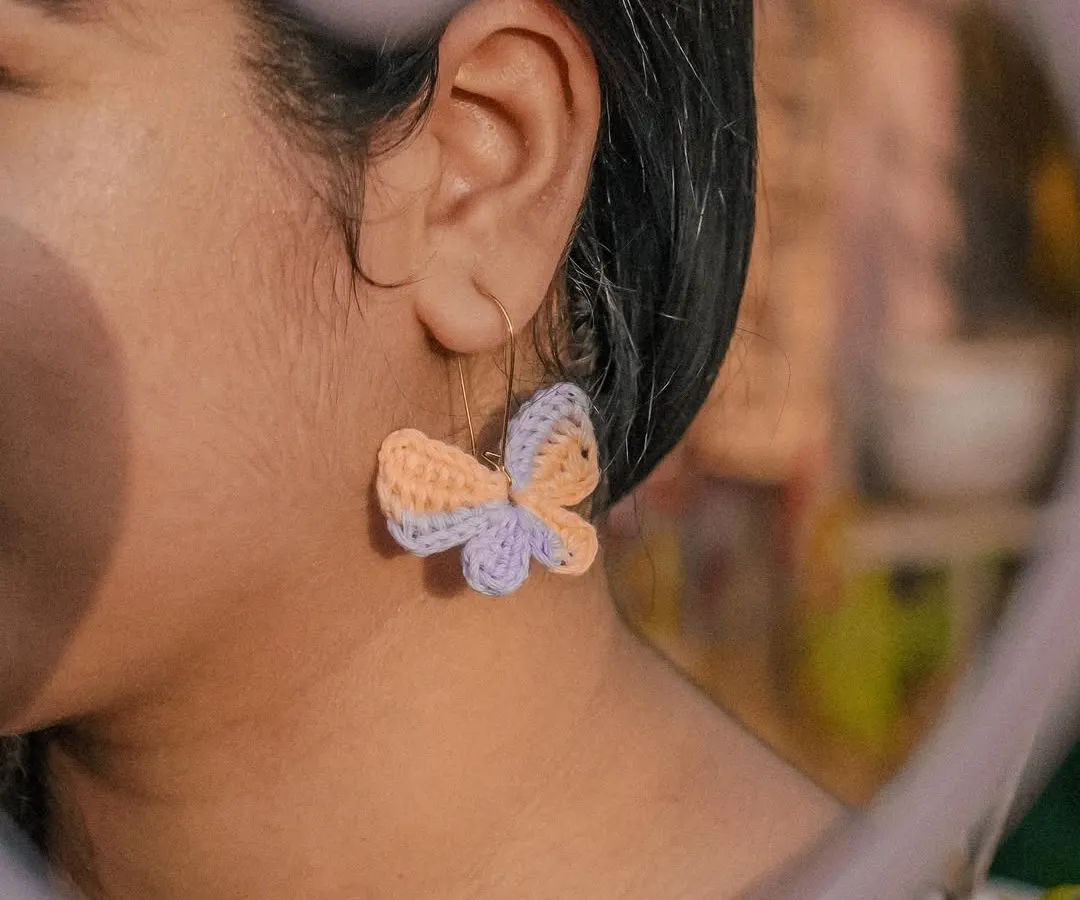 This is the vibe. A close-up of my handmade Titli (butterfly) earrings, crafted from 100% cotton yarn so they're super lightweight. They add that perfect whimsical touch to any look.