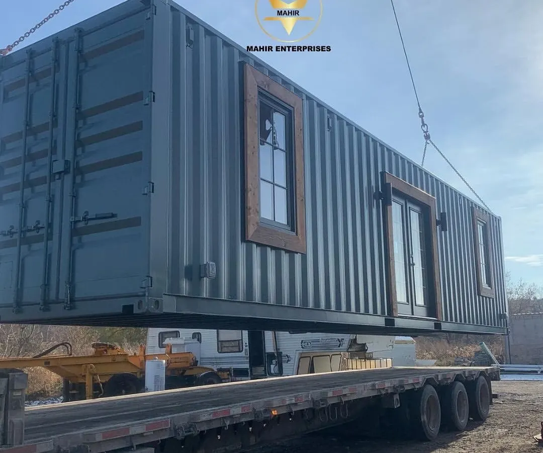 We handle the entire logistics process, from factory to your site. Here, a custom-built container home is carefully loaded for delivery, showcasing the robust and portable nature of our prefabricated structures.