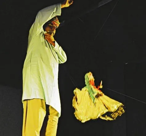 A moment of pure energy on stage. Here, I am performing with a dancing puppet, lost in the story and the music. We bring this passion to every show, making the kathputli dance, fight, and fly.