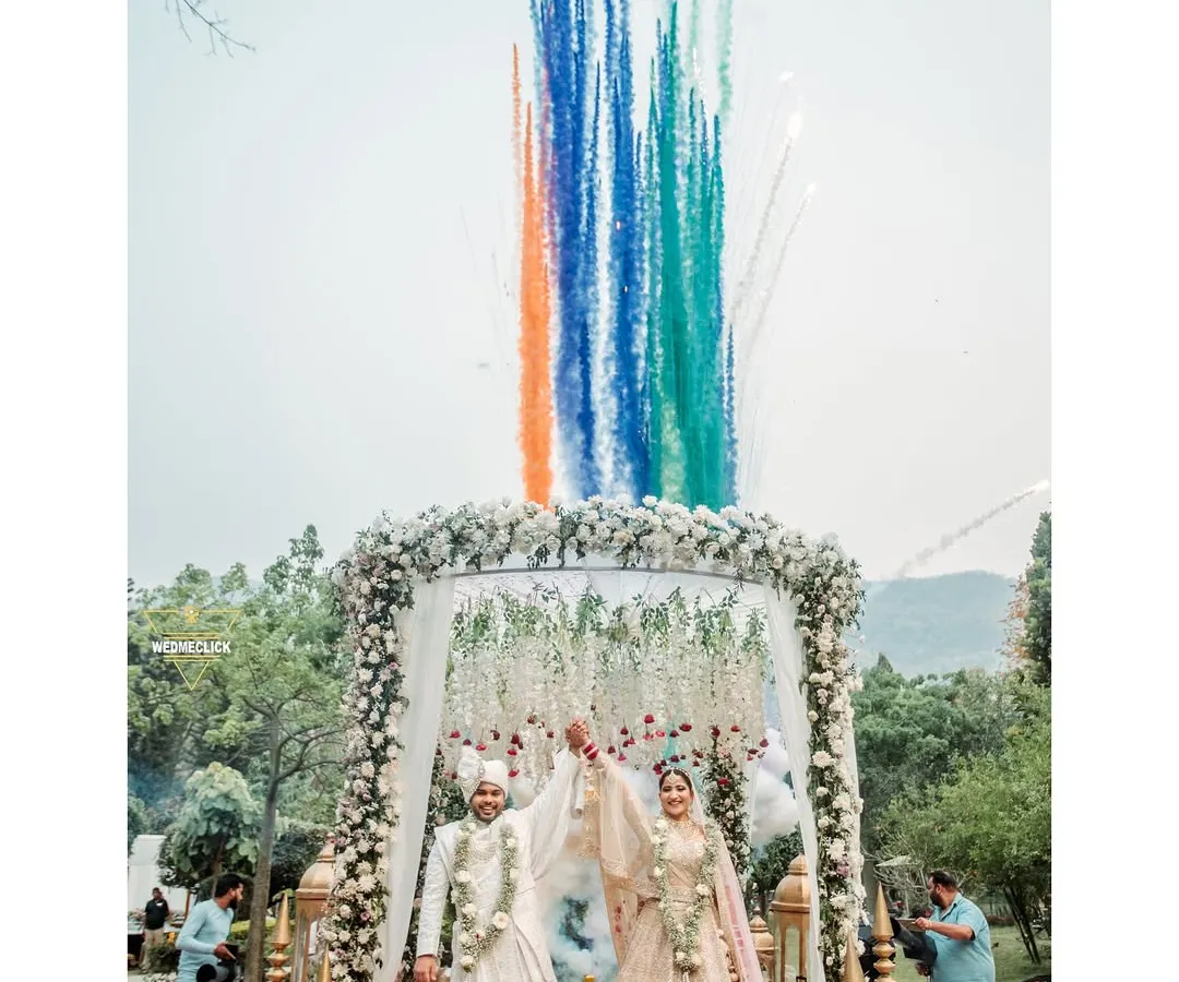 This is what a destination wedding is all about. We love capturing the peak of the celebration, like this varmala moment in the mountains, complete with vibrant smoke colors that make the memory feel as epic as it was in person.