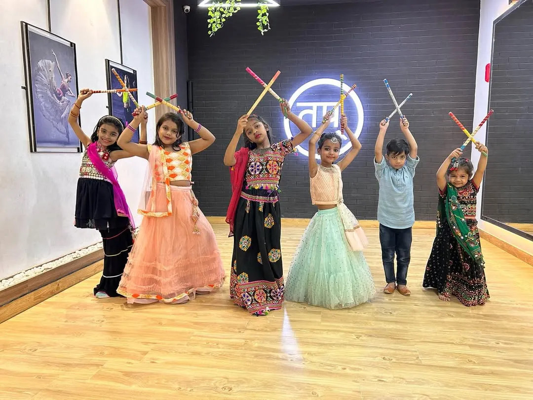 Look at the joy on these faces. This is from our kids' Garba and Dandiya celebration. I love bringing festive energy into the studio, and the kids get to learn traditional dance forms in colorful costumes.