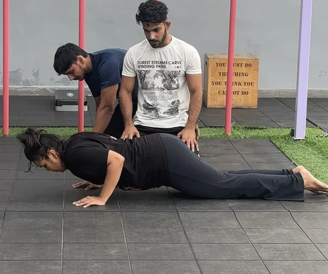 It all starts with the basics, and we make sure you get them right. Here, I am providing hands-on feedback to correct push-up form. Whether you're a complete beginner or an experienced athlete, our personalised coaching ensures you build a strong, injury-free foundation.