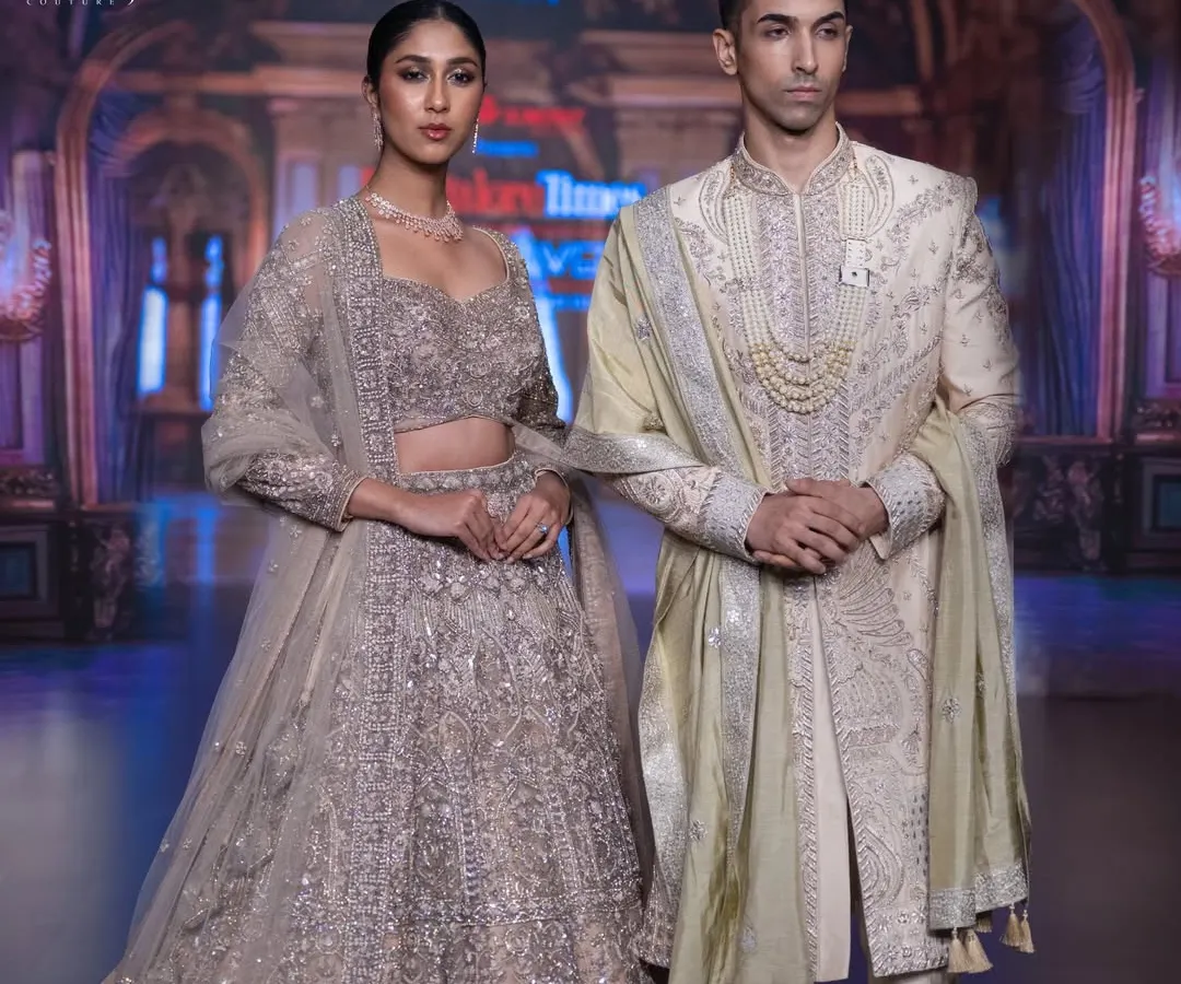 This is the embodiment of classic elegance on the runway. I crafted this off-white raw silk sherwani with exquisite zardozi hand embroidery and paired it with a traditional pearl necklace to create a look of timeless, regal sophistication.