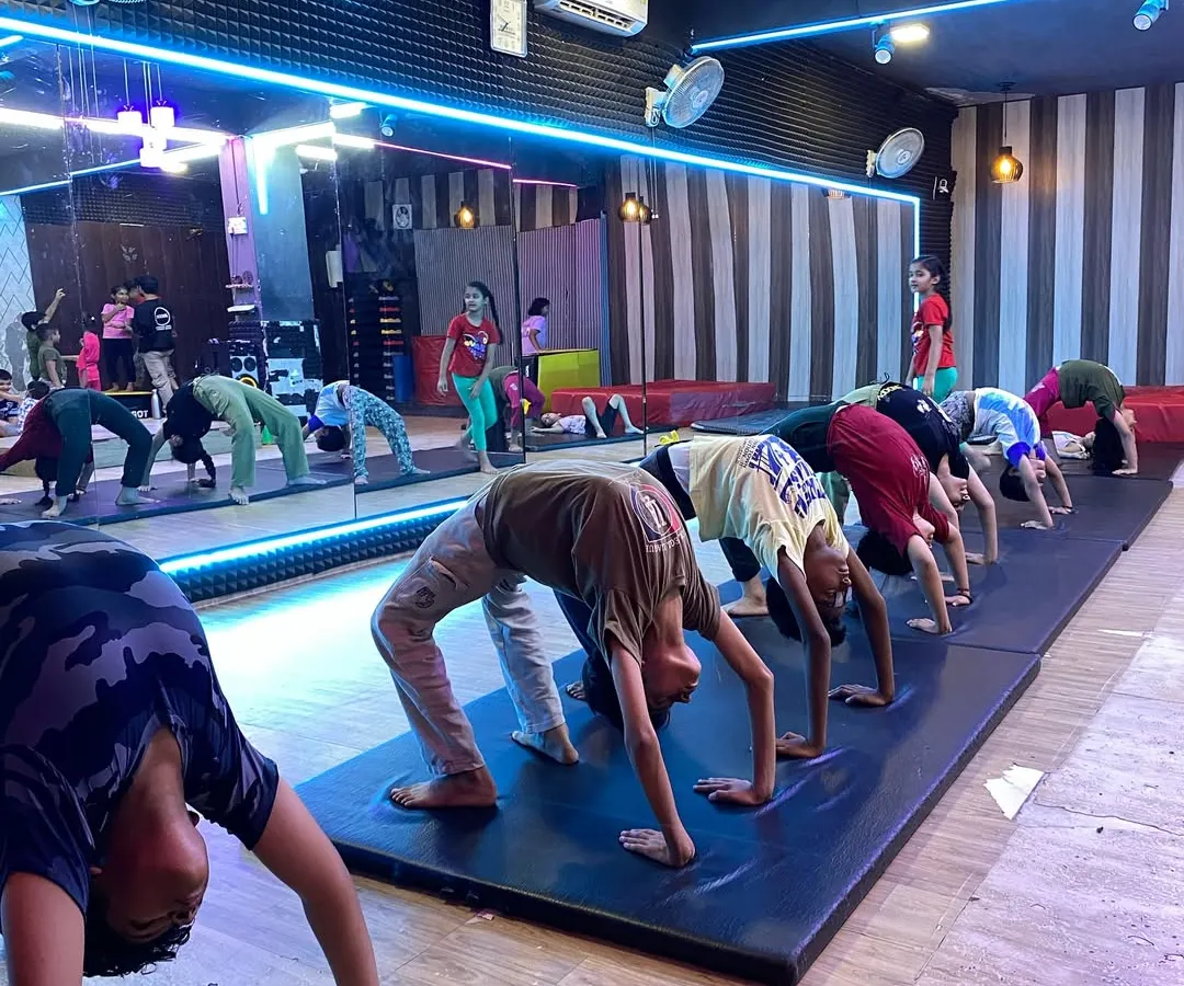 A typical day in our kids' gymnastics class. We focus on building a strong foundation with fundamental exercises like the backbend, which improves flexibility and core strength for all our young gymnasts.