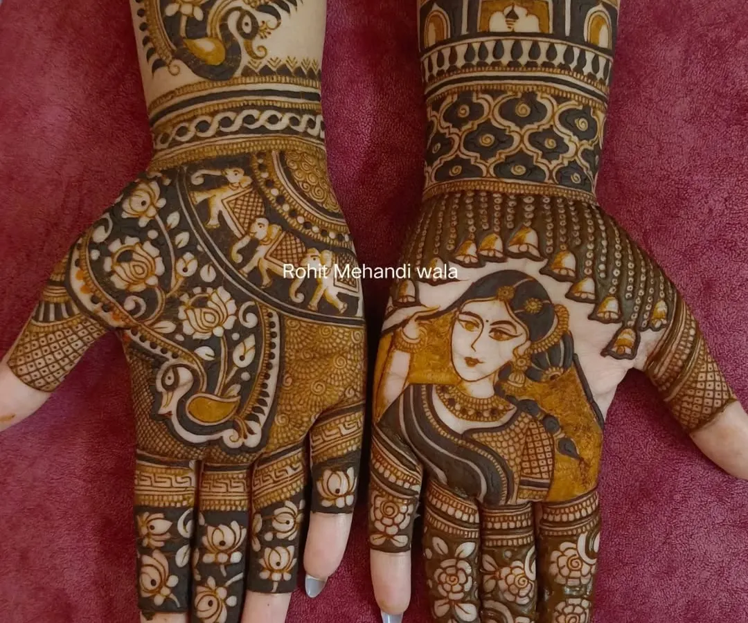 I specialize in creating custom portrait mehandi. Here, I designed a beautiful bride's portrait on the palm, surrounded by delicate details like hanging bells (jhumars), making the henna art truly personal and unique.