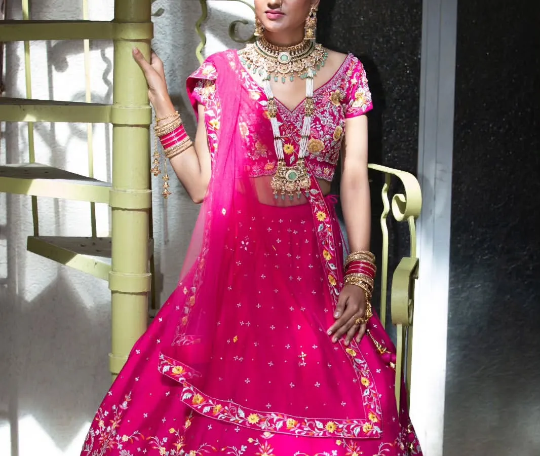 For this designer bridal lookbook, I focused on the vibrant color and intricate embroidery of the lehenga. The studio setting with the spiral staircase adds a unique architectural element to this fashion portrait, making the garment stand out.