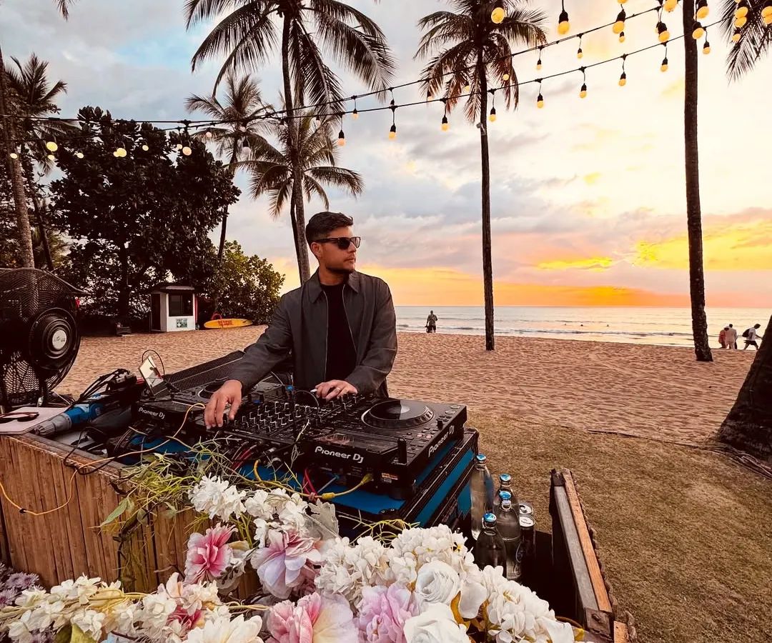 I also specialize in creating the perfect vibe for more intimate, scenic events. Here I am spinning a sunset set at a beautiful beachside gathering, blending music with the magic of the moment.