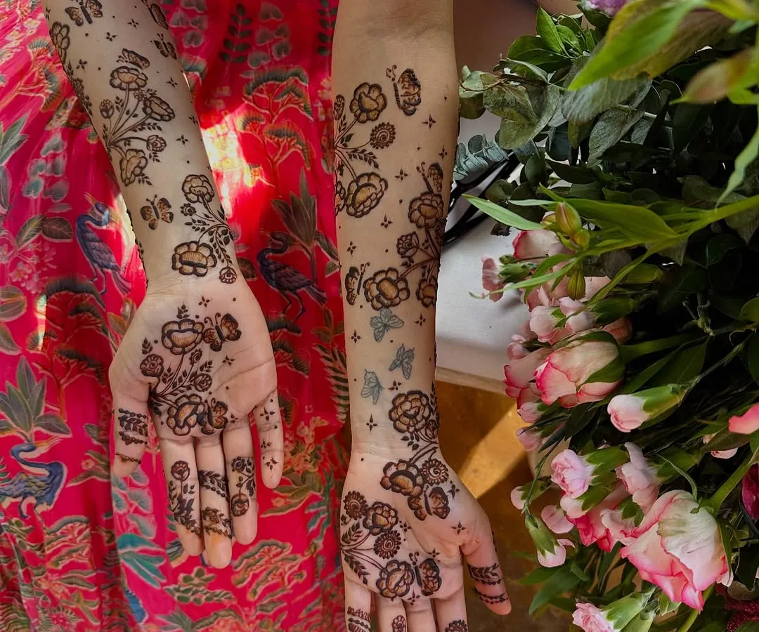 For those who love a lighter touch, I create modern minimalist designs like these scattered floral and butterfly patterns. This style is chic and playful, offering a contemporary take on traditional henna art that feels fresh and personal.