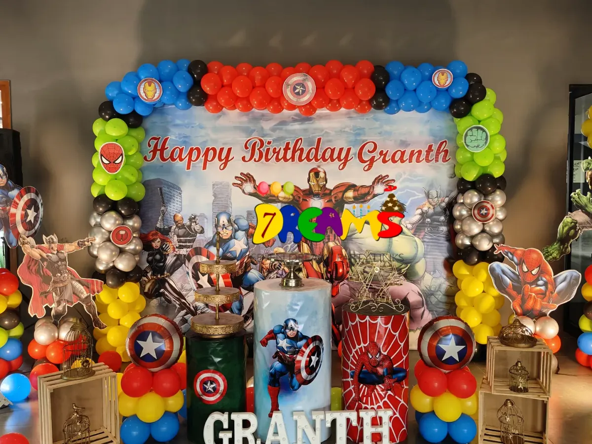 For the ultimate superhero fan, I created this full Avengers stage. It features a custom backdrop with all the heroes, balloon columns in character colors, and life-size cutouts of Captain America, Iron Man, and Spider-Man.