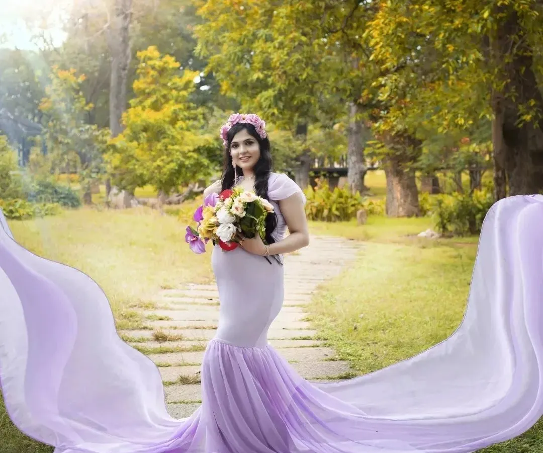 For this outdoor maternity shoot, I created a soft, ethereal look. The makeup is minimal and fresh to enhance her natural glow, paired with gentle waves and a flower crown to match the dreamy lavender gown.