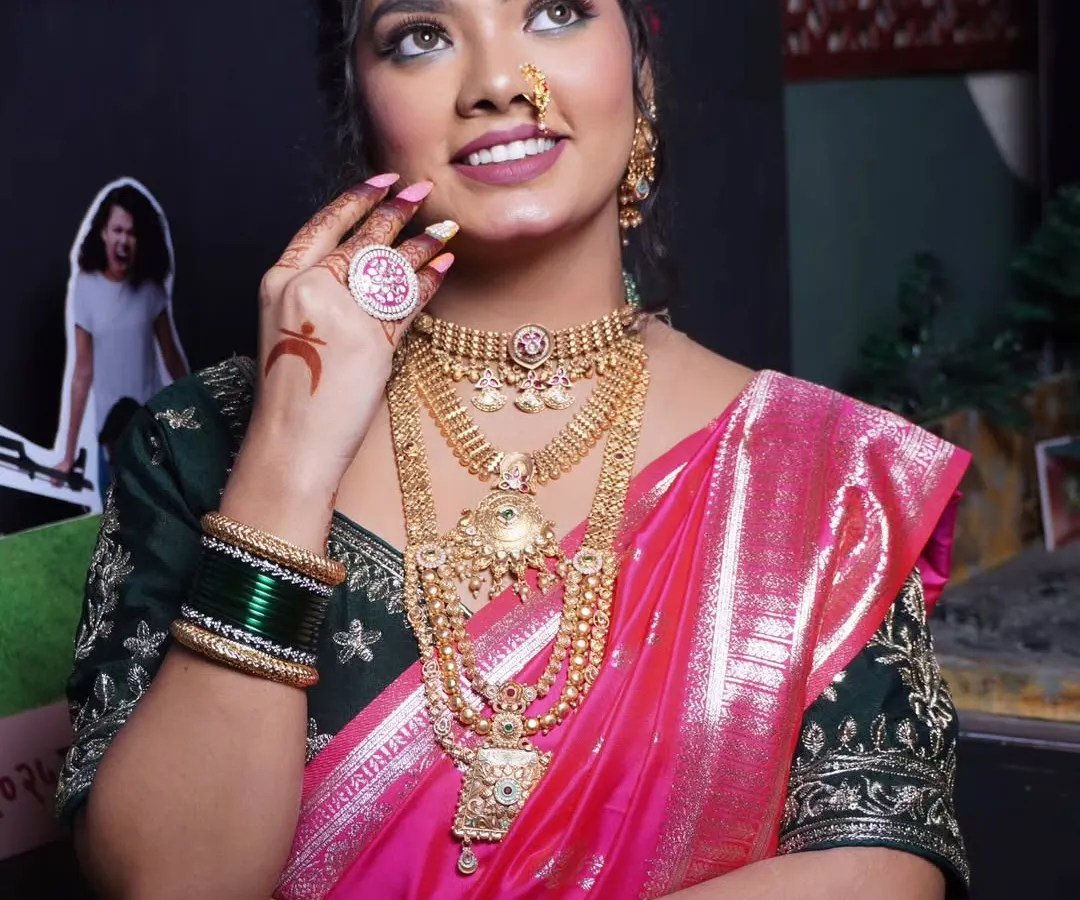 A classic Maharashtrian bridal look, complete with a traditional nath and jewellery. We teach every detail, from the perfect winged liner to a base that glows under any light, so my students can create this timeless beauty.