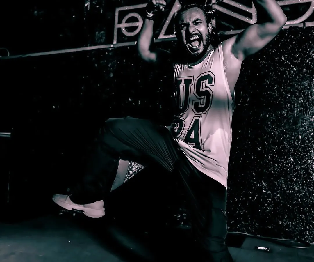 This is me in my element, born to perform and destined to shine on stage. This shot captures the raw energy and passion I bring to every single event.