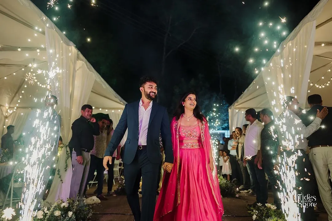 This is the magic of a cocktail event in a Malnad coffee estate. We created a grand entrance for the couple with a canopy of lights and cold pyro, setting a celebratory and serene tone for the evening.