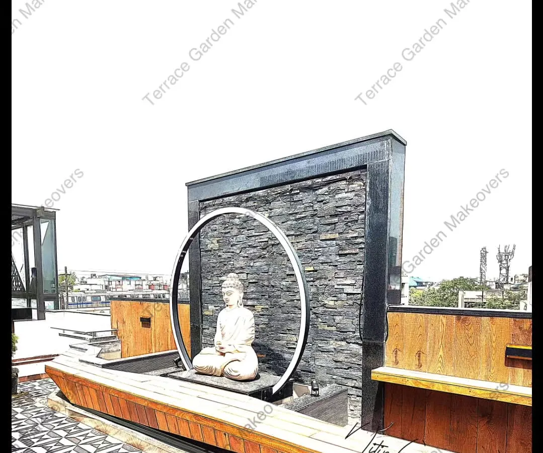 I designed this terrace to be a complete sensory experience. The centerpiece is a custom water feature with a meditating Buddha statue, framed by a modern circular light. The design is tied together with a stacked slate wall and integrated wooden bench seating.