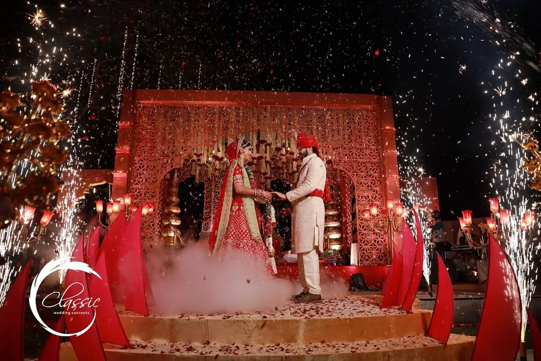 A moment of pure magic. I designed this opulent red and gold mandap to feel both royal and deeply romantic, with perfectly timed pyrotechnics to celebrate the couple's union under the stars.