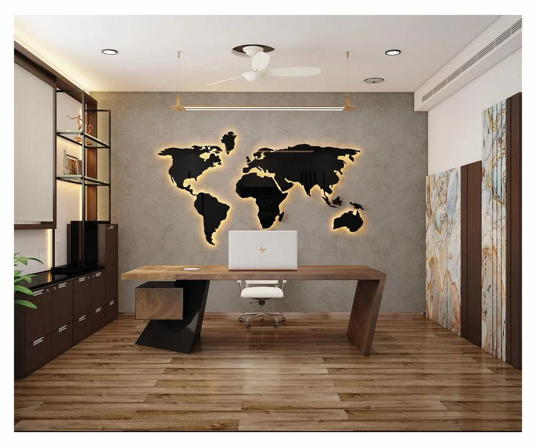 For this director's cabin at SVG Exports, we created a sophisticated and globally-minded atmosphere. The design features a custom-designed desk, rich wood flooring, and a backlit world map on a concrete-finish wall, balancing modern aesthetics with professional warmth.