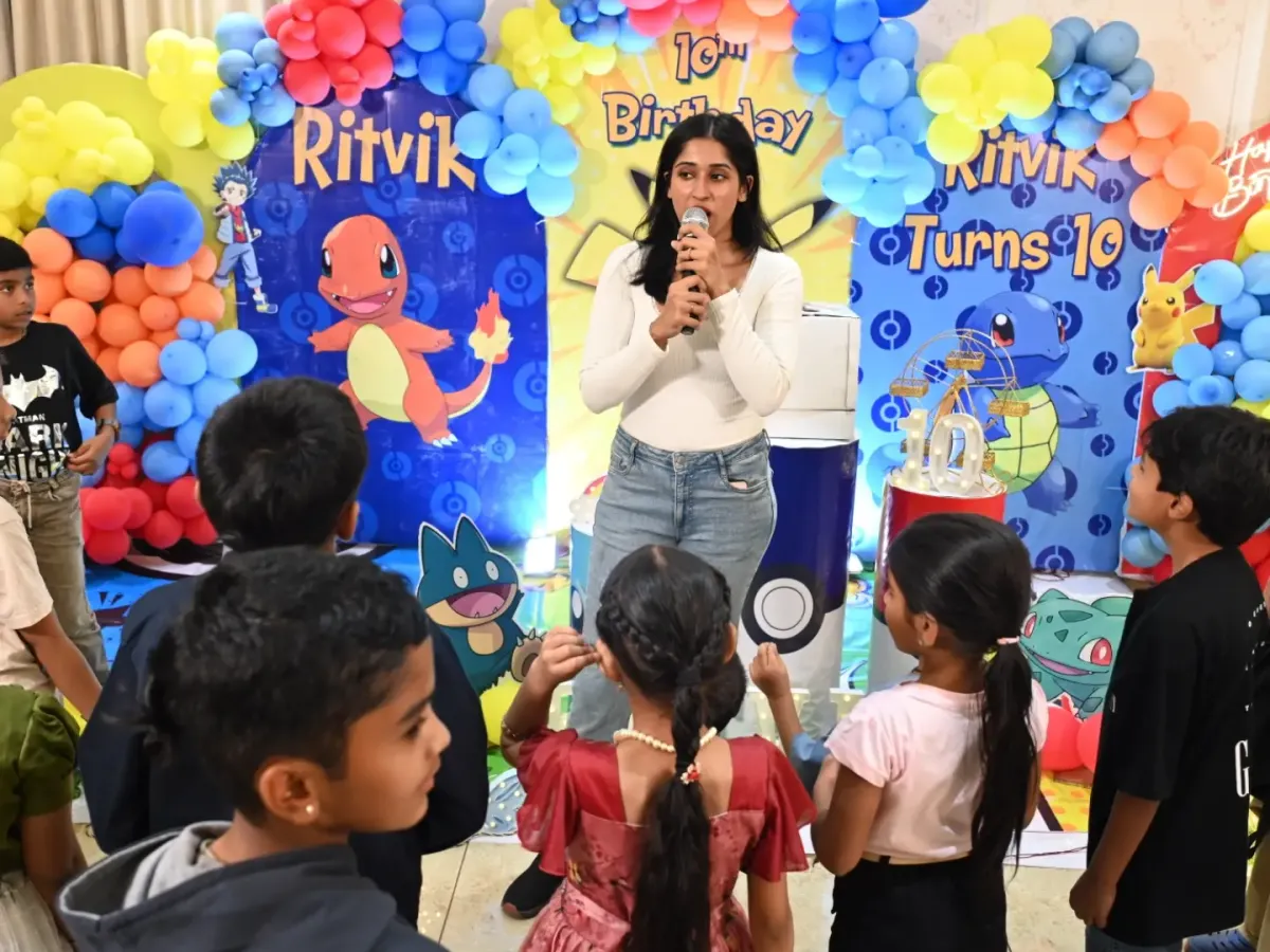 This is my happy place, right in the middle of the fun at a kids' birthday party. I was getting the kids ready for a game at this Pokémon themed celebration, making sure everyone felt like part of the adventure.