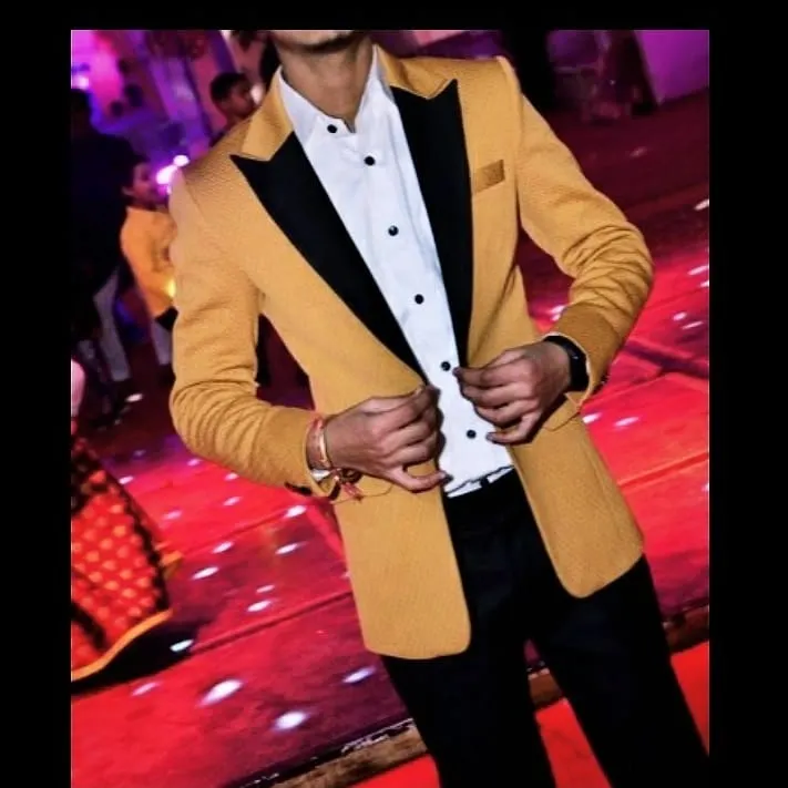 For parties and celebrations, I create statement blazers that stand out. This custom mustard yellow blazer features a contrasting black shawl lapel, creating a sharp, modern look perfect for a wedding reception or a special night out.