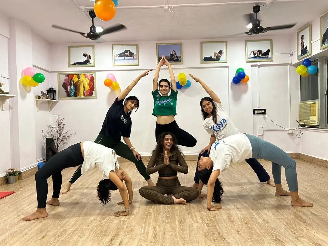 This is our Kaya Family. We support, lift, and grow with each other, creating beautiful shapes and even better friendships on and off the mat.