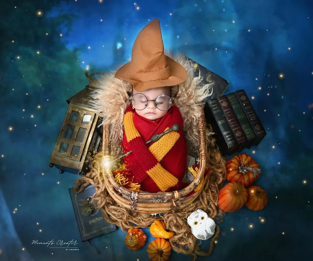 Wingardium Leviosa! Our tiniest wizard is ready for his journey to Hogwarts. This Harry Potter themed setup, complete with a sorting hat, magic wand, and glowing lights, is perfect for parents who want to add a touch of enchantment to their newborn's first portraits.