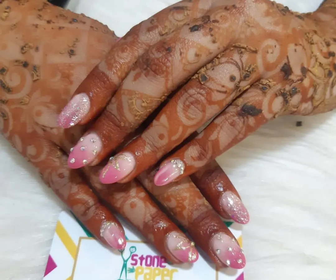Getting ready for a party with some festive henna. This design is a bit lighter and perfect for when you want beautiful mehendi that complements your overall look, including your nails.
