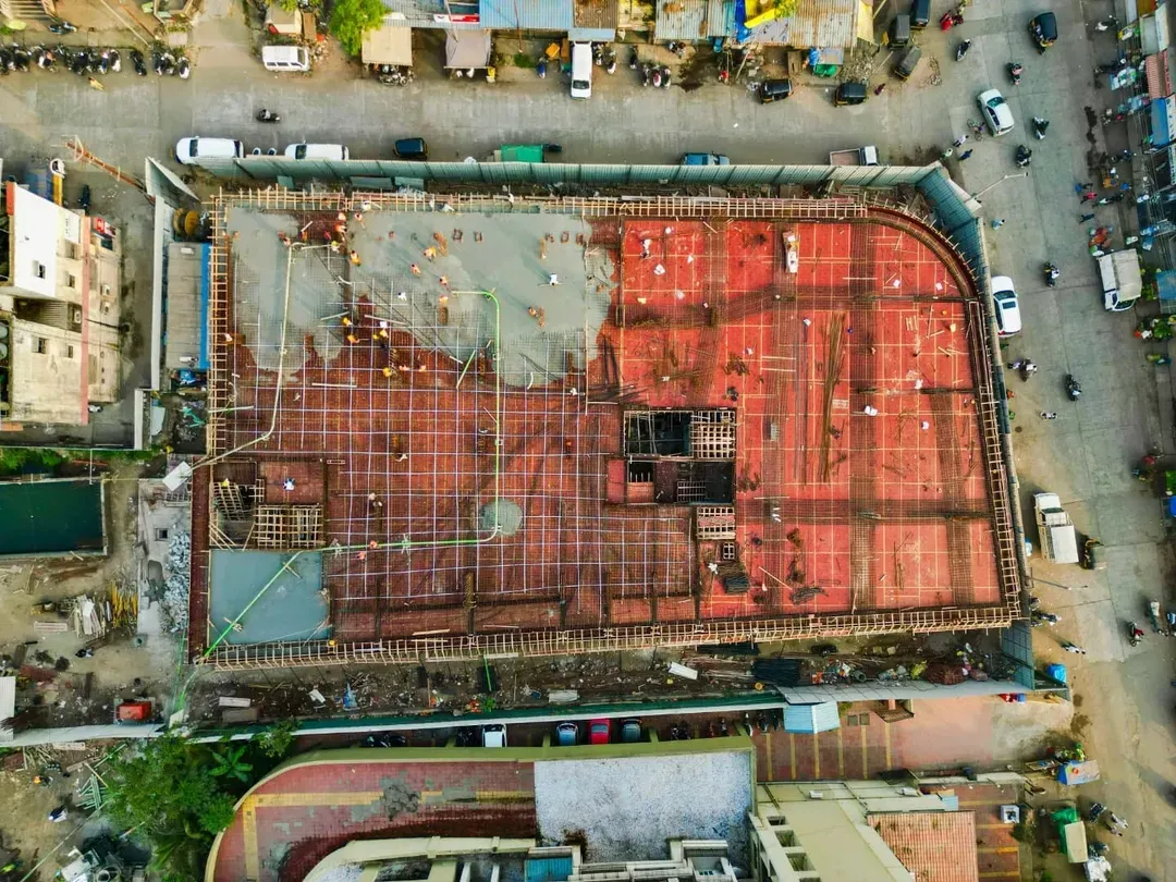 Our drone photography services offer a top-down perspective for large-scale projects. This aerial shot documents the slab work of a construction site in Mumbai, providing a clear and detailed progress report for real estate and development clients.