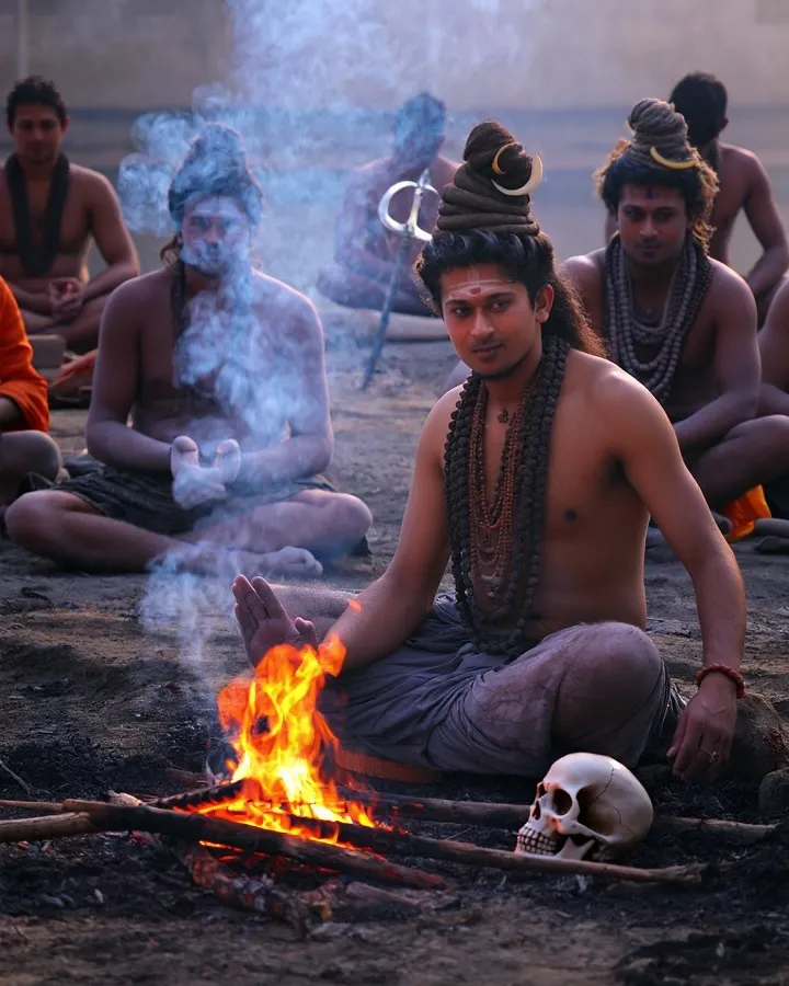 My spiritual practice is rooted in deep traditions, like those of the sadhus who sit by the fire. This image represents the transformative power of turning away from worldly noise to listen to the inner self, a core principle I bring to my guidance sessions.