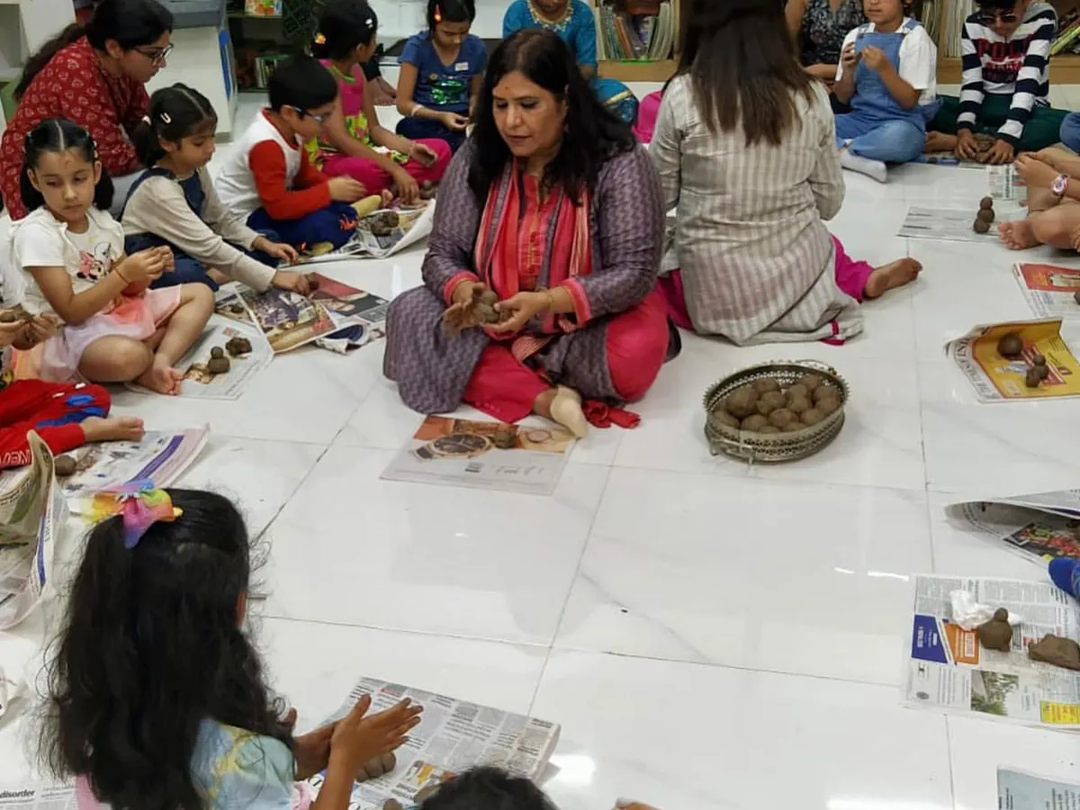 It's not just about listening to stories; it's about creating them too. Here, I'm guiding children as they make their own clay Ganeshas during our 'Ganpati ki Gaathayein' workshop. This hands-on activity helps them connect with the story on a deeper, more personal level.
