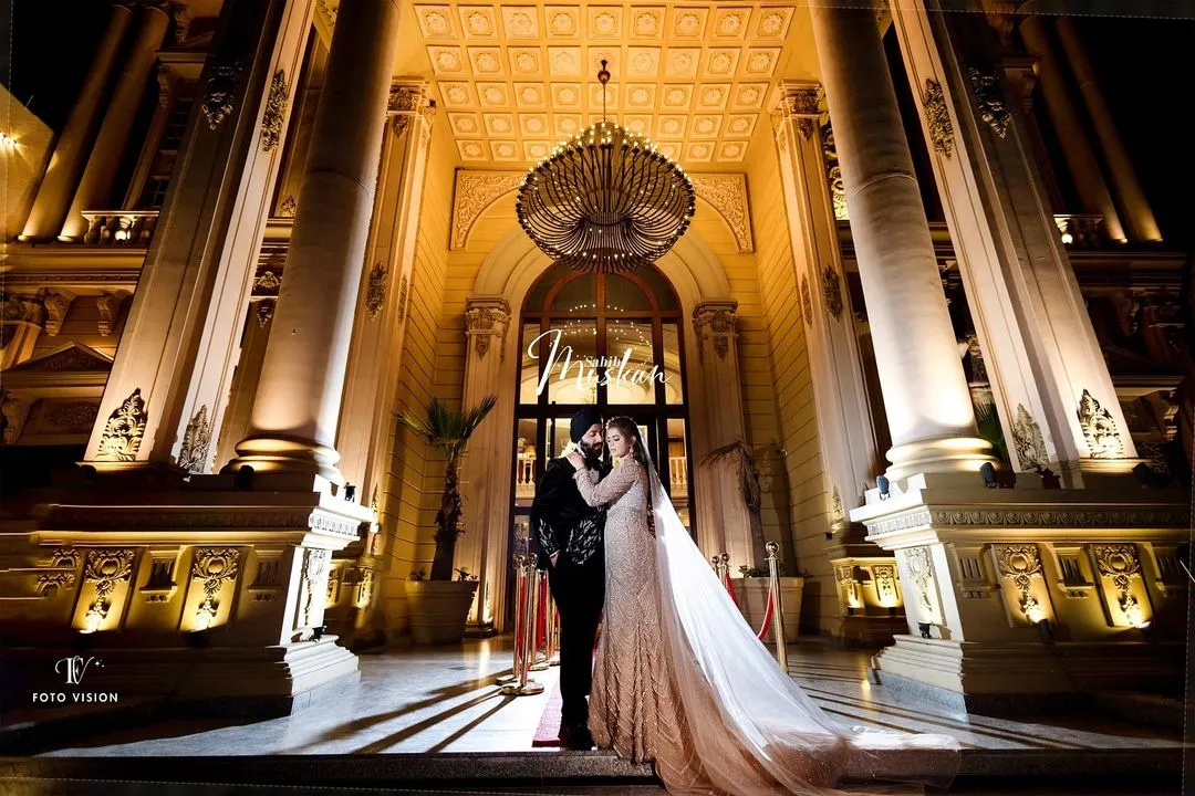 A portrait of modern royalty. We framed Sahib and Muskan against the magnificent architecture, using dramatic lighting to create a sense of grandeur and timelessness. This is how we turn wedding portraits into cinematic art.