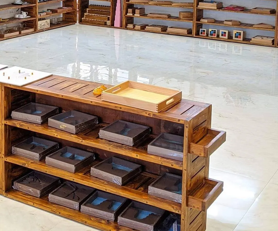 Welcome to our prepared environment. The shelves are filled with Montessori materials, openly accessible for children to choose their own work. This setup is the foundation of self-directed learning, allowing each child to follow their curiosity at their own pace.