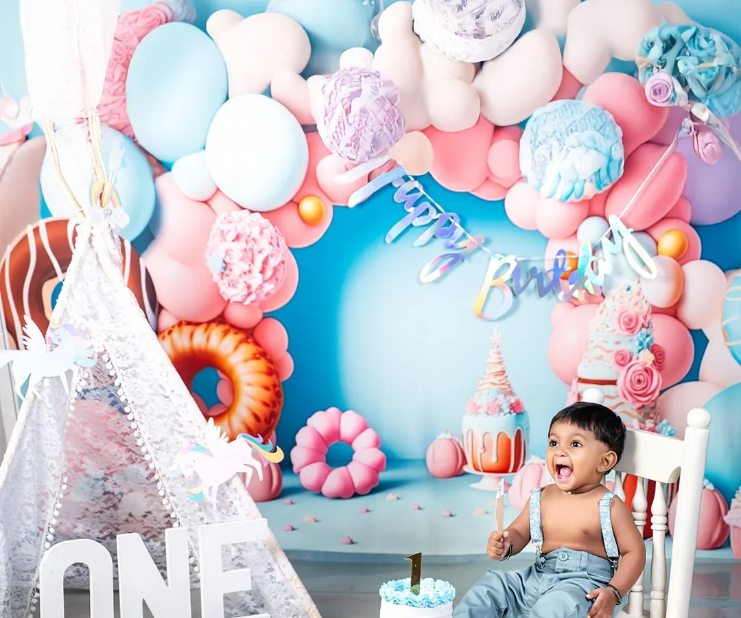 The pure, unfiltered joy of a first birthday cake smash! This is what it's all about: celebrating milestones with laughter, a little bit of mess, and a whole lot of fun in my colorful studio setup.