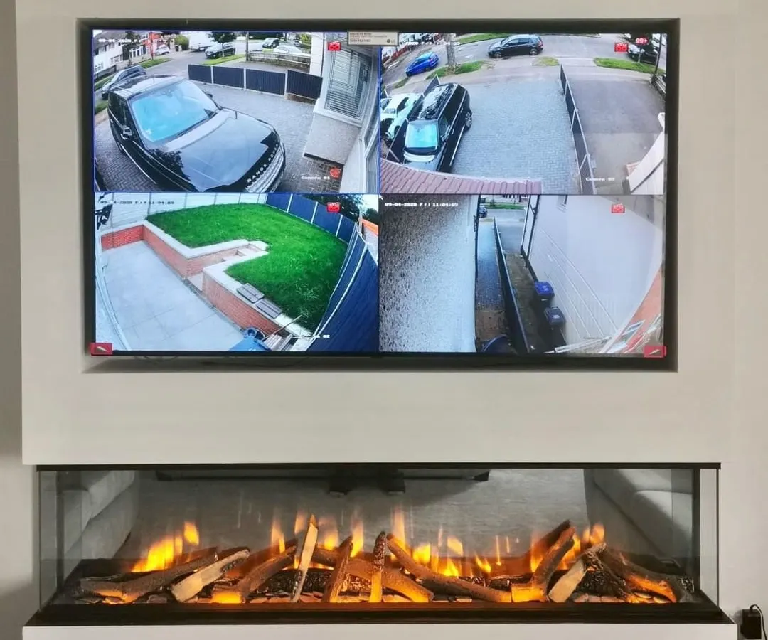 This is the end result of a clean installation: a live multi-camera view displayed seamlessly in a modern living room. We ensure your security system integrates perfectly with your home, allowing you to monitor your driveway, garden, and entrance from one screen.