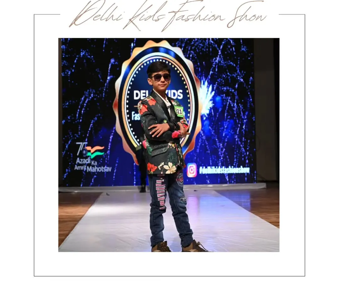 It's all about the attitude. This young model shows off his confidence and unique style in a floral blazer and denim, proving that fashion is for everyone. My events are a space for kids to express their personality and own the stage.
