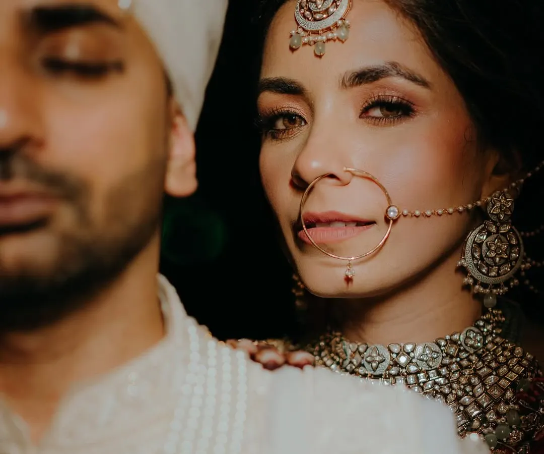An intimate and artistic bridal portrait that focuses on the bride's expressive eyes and intricate jewelry. We aim to create iconic, magazine-worthy shots that highlight your unique beauty.