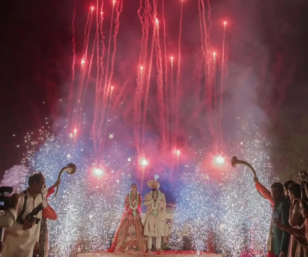 I believe every union deserves a grand beginning. This shot captures the pinnacle of celebration, where I coordinate spectacular fireworks and dramatic lighting to create a breathtaking, unforgettable moment for the couple and their guests.